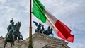 Rome - Italian national flag with scenic view on the front facade of Victor Emmanuel II monument on Piazza Venezia in Rome Royalty Free Stock Photo