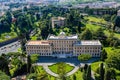 Aerial front view of government building with surrounding green garden in the Vatican Rome.
