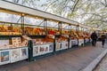 Book and souvenir stands and people shopping along Tiber River in Rome