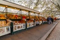 Book and souvenir stands and people shopping along Tiber River in Rome