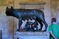 ROME, ITALY - APRIL 6, 2016: The bronze statue of the Capitoline Wolf Lupa Capitolina in the Capitoline Museums with tourists.