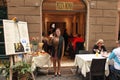 Rome, Italy - APRIl 9, 2017 : A smiling employee of the restaurant welcomes visitors at the entrance.
