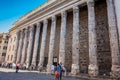 Tourists and locals at the surviving side colonnade of the Temple of Hadrian