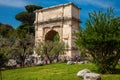 Tourists visiting the Arch of Titus located on the Velian Hill