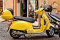 ROME, ITALY - APRIL, 30: Yellow retro Italian scooter Vespa on the street in Rome, April 30, 2013