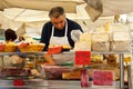 ROME, ITALY - APRILE, 6: Seller of cheese and prosciutto on the market Campo dei Fiori, Aprile 6, 2013