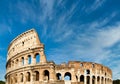 Rome, Italy. Arches archictecture of Colosseum exterior with blue sky background and clouds Royalty Free Stock Photo