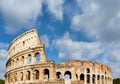 Rome, Italy. Arches archictecture of Colosseum exterior with blue sky background and clouds Royalty Free Stock Photo