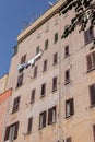 Clothes hanging for dry outside the building wall