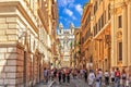Italian street Via dei Condotti, leading to Piazza di Spagna and the Spanish Steps on a sunny day