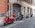 ROME, ITALY - AUGUST 1, 2015: Motorcycles In A Cobbled Street