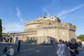 People on the background of Castel Sant`Angelo, an architectural monument on the banks of the Tibe