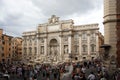 Rome/Italy - August 4, 2009: The Trevi Fountain Italian: Fontana di Trevi on a cloudy day with the surrounding area in front ful