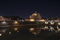 Rome Italy. Beautiful view of Castel Sant`Angelo and the bridge at night with reflections on the Tiber river Royalty Free Stock Photo