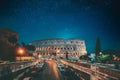 Rome, Italy. Bold Bright Blue Azure Night Starry Sky With Glowing Stars Above Colosseum Also Known As Flavian