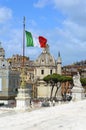 Rome, Italy. Churches, Trajan`s Column and Italian flag - view from Vittorio Emanuele monument