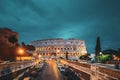 Rome, Italy. Colosseum Also Known As Flavian Amphitheatre In Evening Or Night Time Royalty Free Stock Photo