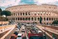 Rome, Italy. Colosseum. Red Hop On Hop Off Touristic Bus For Sightseeing In Street Near Flavian Amphitheatre. Famous Royalty Free Stock Photo