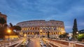 Rome, Italy. Colosseum. Traffic Near Flavian Amphitheatre During Sunset, Evening And Night Time. Famous World Landmark Royalty Free Stock Photo