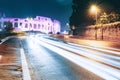 Rome, Italy. Colosseum View From Another Side In Night Time. Night Traffic Light Trails Near Famous World Landmark Royalty Free Stock Photo