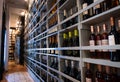 Big shelf with many wine bottles in wine shop