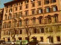 Rome, Italy, December 10, 2019. The facade of a multi-storey residential building in Rome. Italian urban architecture. Sunny