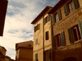 Rome, Italy, December 10, 2007. Facades of residential buildings in Italy. Sunny warm lighting. Windows and shutters