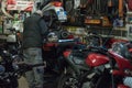 Rome, Italy. December 04, 2017: Man working in garage repairing