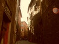 Rome, Italy, December 10, 2007. Narrow streets of Italy. Ancient Italian houses, standing next to each other. Tourists walk the