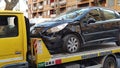 Rome, Italy, December 31. 2022. Wrecked car after an accident on a tow truck transported Royalty Free Stock Photo