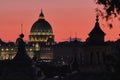 Rome, Italy, Dome of St Peter Basilica at sunset on a background of red sunset sky Royalty Free Stock Photo