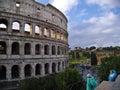 Tourists in raincoats near the Coliseum in Rome, Italy Royalty Free Stock Photo