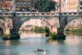 Rome, Italy. Group Of People Training On Kayak. Sightseeing Boat Floating Near Aelian Bridge. Tour Touristic Boat