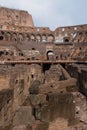 Rome, Italy - Interior of Roman Colosseum, an ancient oval amphitheater. Inside largest Colosseo. Vertical of famous landmark. Royalty Free Stock Photo