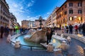 Rome, Italy - January 10, 2019: Fountain on the Piazza di Spagna square and the Spanish Steps in Rome at dusk, Italy Royalty Free Stock Photo