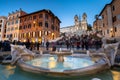 Rome, Italy - January 10, 2019: Fountain on the Piazza di Spagna square and the Spanish Steps in Rome at dusk, Italy Royalty Free Stock Photo