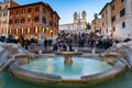 Rome, Italy - January 10, 2019: Fountain on the Piazza di Spagna square and the Spanish Steps in Rome at dusk, Italy Royalty Free Stock Photo