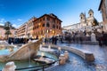 Rome, Italy - January 10, 2019: Fountain on the Piazza di Spagna square and the Spanish Steps in Rome at dusk, Italy Royalty Free Stock Photo