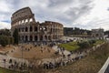 Rome, Italy, January 25th, 2019 - Panoramic view of the Colosseum and Constantine Arch with long queues in the entrance Royalty Free Stock Photo
