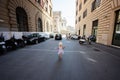 Rome, Italy - July 27, 2022: Family tourists walk in street, Rome, Italy