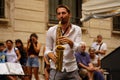Rome, Italy - July 27, 2020: Italian saxophonist of a jazz street band
