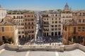 People enjoy Spanish stairs on Piazza di Spagna in Rome. Spanish stairs with the Fountain Barcaccia in Rome is famous touristic