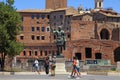 Tourists and bronze statue of Emperor Trajan, Rome, Italy.