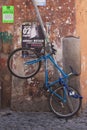 Rome, Italy - June 28, 2010: A bike, hanging in a corner