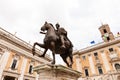 Bottom view of statue of marcus aurelius under grey sky