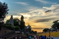 Rome, Italy - 24 June 2018: Golden sunset at the tomb of the unknown soldier viewed from the colosseum. Famous world landmark.