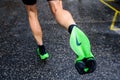 ROME, ITALY, JUNE 23. 2020: Nike running shoes ALPHAFLY NEXT%. Controversial green athletics shoe on legs of professional athlete