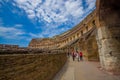 ROME, ITALY - JUNE 13, 2015: People inside Roman Coliseum visiting and learning italian heritage Royalty Free Stock Photo