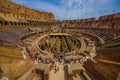 ROME, ITALY - JUNE 13, 2015: Roman Coliseum inside view, historical monument and turists walking around