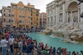 Sunset view of People visiting Trevi Fountain Fontana di Trevi in city of Rome, Italy